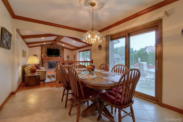 38188 Mallory Dr, Livonia, MI 48154 - dining area featuring a chandelier, a brick fireplace, crown molding, and light tile patterned floors