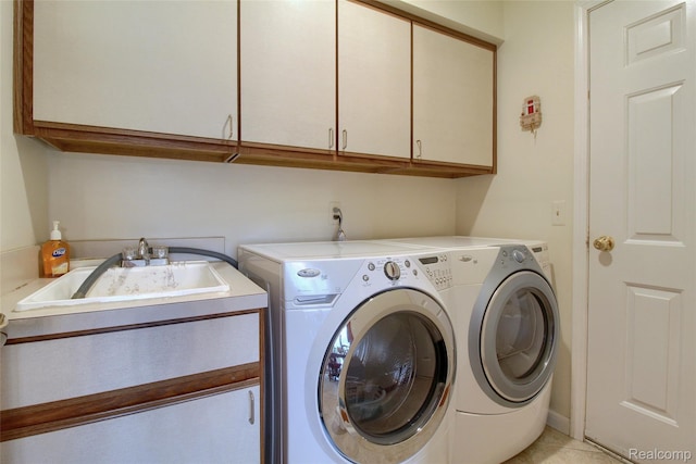 38188 Mallory Dr, Livonia, MI 48154 - laundry room featuring cabinet space and separate washer and dryer