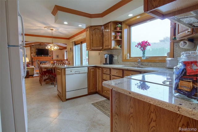 38188 Mallory Dr, Livonia, MI 48154 - kitchen with white appliances, crown molding, a peninsula, brown cabinets, and decorative light fixtures