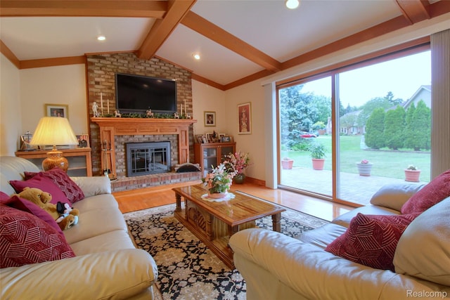 38188 Mallory Dr, Livonia, MI 48154 - living room featuring wood finished floors and a brick fireplace