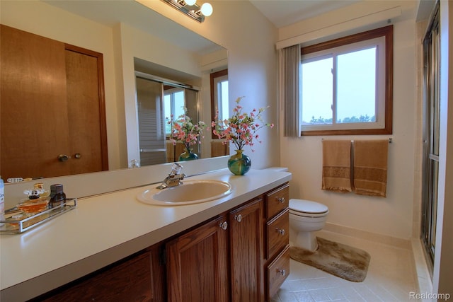 38188 Mallory Dr, Livonia, MI 48154 - full bathroom with vanity, plenty of natural light, tile patterned flooring, and a shower with shower door