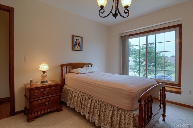 38188 Mallory Dr, Livonia, MI 48154 - bedroom featuring light colored carpet, a chandelier, and multiple windows