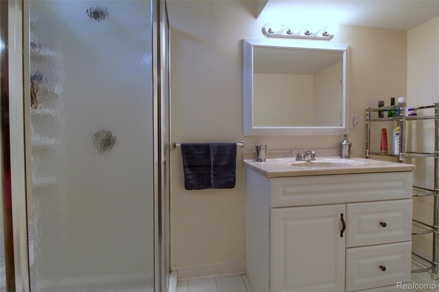 38188 Mallory Dr, Livonia, MI 48154 - full bathroom featuring a shower stall, vanity, and tile patterned flooring