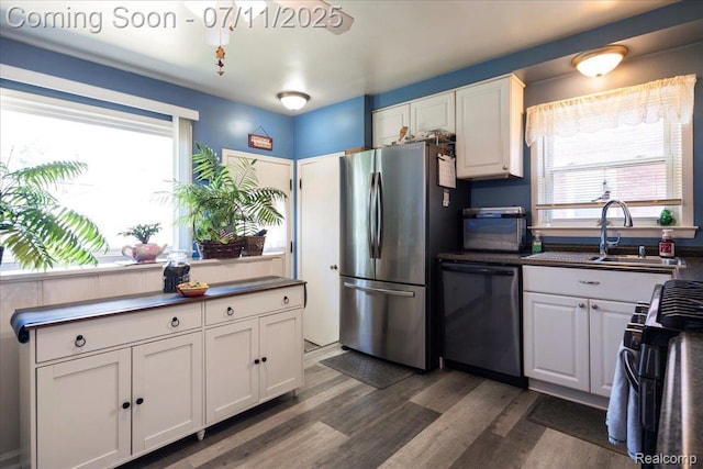 1946 Carlysle St, Dearborn, MI 48124 - kitchen with freestanding refrigerator, dishwashing machine, gas range, and dark countertops