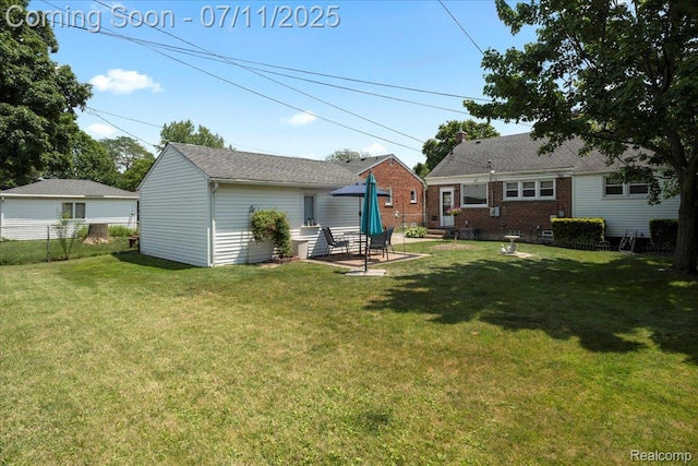 1946 Carlysle St, Dearborn, MI 48124 - view of yard with an outbuilding and a patio