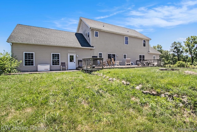 4450 Sylvan Rd, Grass Lake, MI 49240 - back of property featuring a deck and a yard