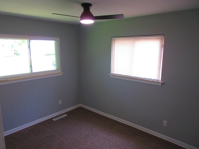 3736 Maryland Ave, Flint, MI 48506 - empty room featuring ceiling fan, healthy amount of natural light, and dark carpet