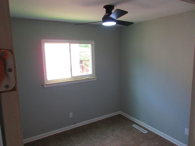 3736 Maryland Ave, Flint, MI 48506 - empty room with a ceiling fan and dark colored carpet