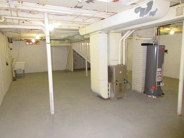 3736 Maryland Ave, Flint, MI 48506 - unfinished below grade area featuring water heater and stairway