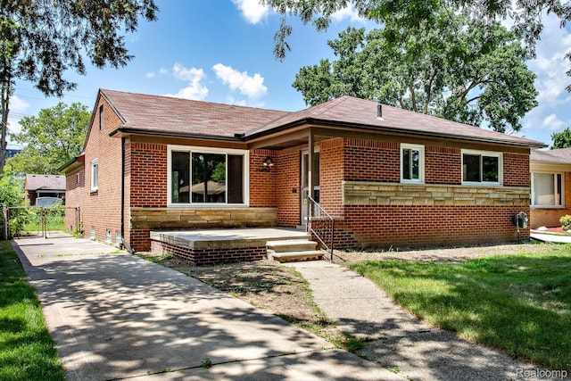 23461 Avon Rd, Oak Park, MI 48237 - view of front of house featuring brick siding and concrete driveway