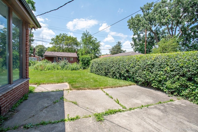23461 Avon Rd, Oak Park, MI 48237 - view of green lawn featuring a patio area
