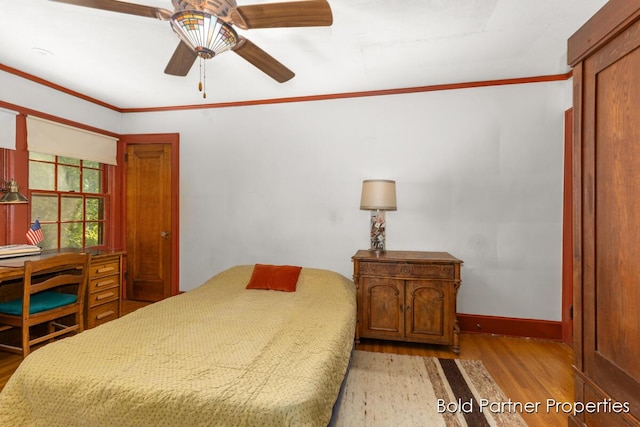 2342 Elliott St SE, Grand Rapids, MI 49506 - bedroom featuring wood finished floors, crown molding, and ceiling fan