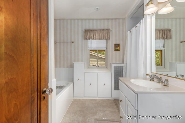 2342 Elliott St SE, Grand Rapids, MI 49506 - full bathroom with wallpapered walls, vanity, and a garden tub