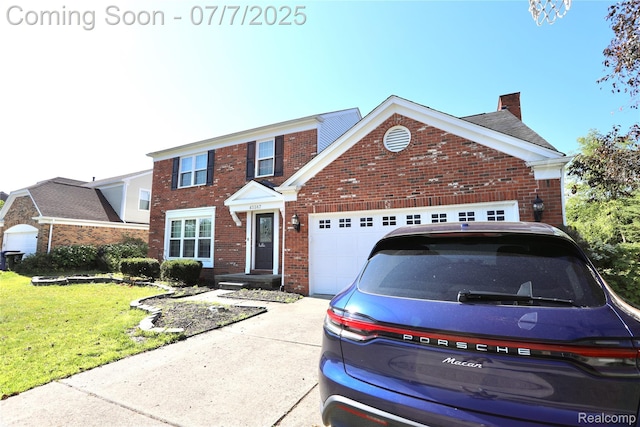 45587 Hanford Rd, Canton, MI 48187 - traditional-style home featuring brick siding, a garage, a chimney, a front lawn, and driveway