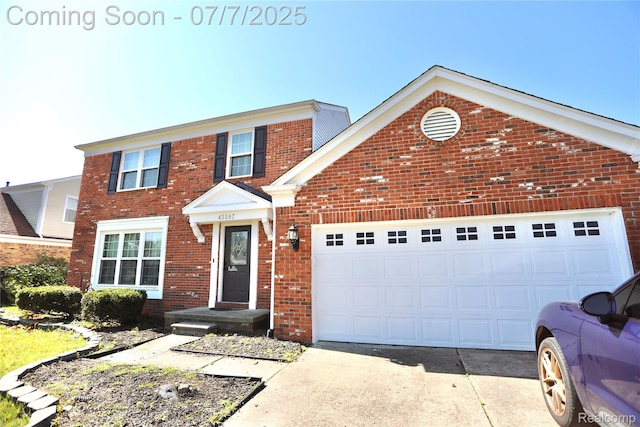 45587 Hanford Rd, Canton, MI 48187 - traditional-style home featuring driveway, brick siding, and a garage