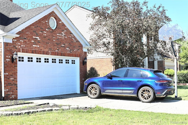 45587 Hanford Rd, Canton, MI 48187 - view of side of property with brick siding, driveway, a garage, and roof with shingles