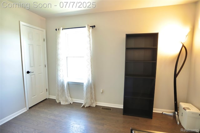 45587 Hanford Rd, Canton, MI 48187 - unfurnished bedroom featuring dark wood-style flooring and baseboards