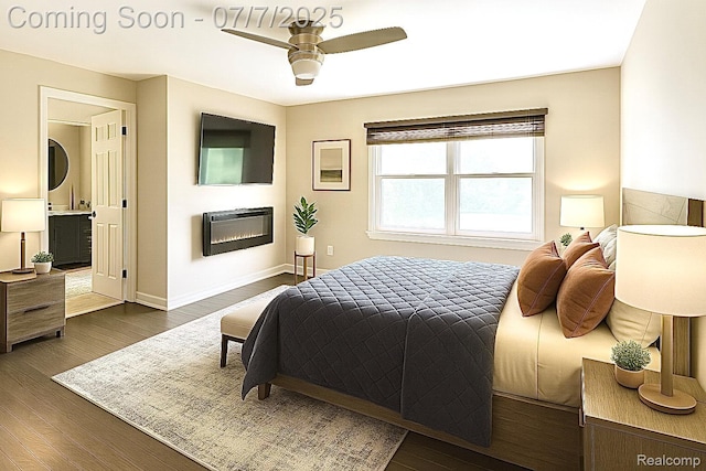 45587 Hanford Rd, Canton, MI 48187 - bedroom featuring stacked washer / dryer, dark wood-style floors, a ceiling fan, and ensuite bathroom