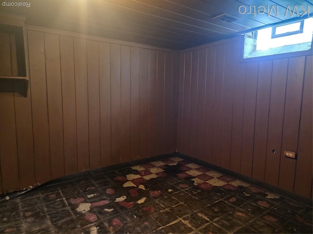18639 Kelly Rd, Detroit, MI 48224 - basement featuring dark flooring and wooden walls