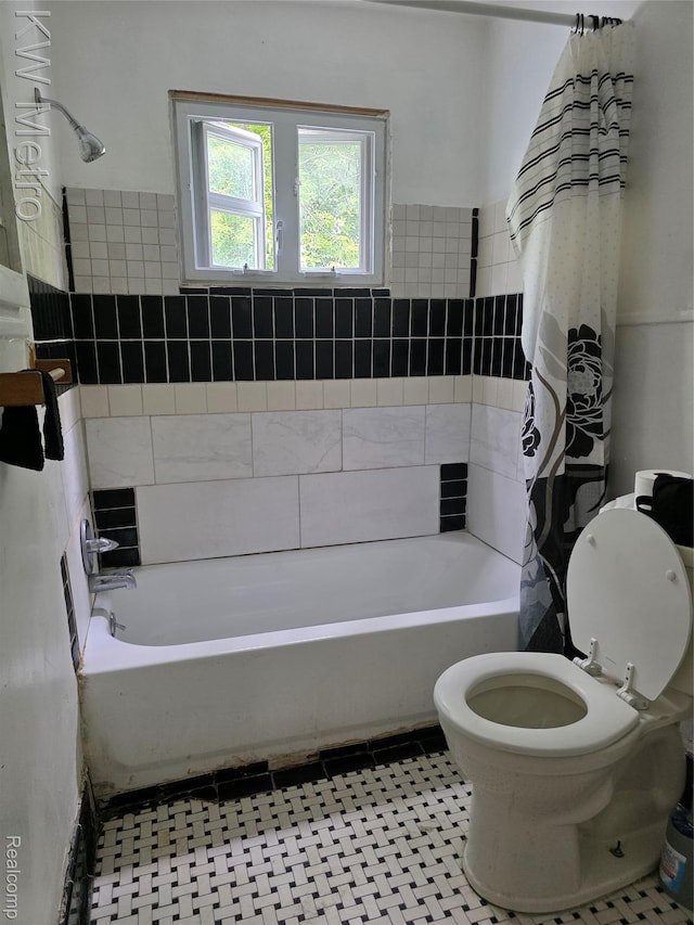 18639 Kelly Rd, Detroit, MI 48224 - bathroom with shower / bath combo with shower curtain and tile patterned floors