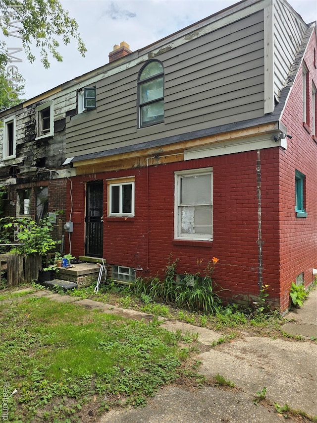 18639 Kelly Rd, Detroit, MI 48224 - view of front of property featuring a chimney and brick siding