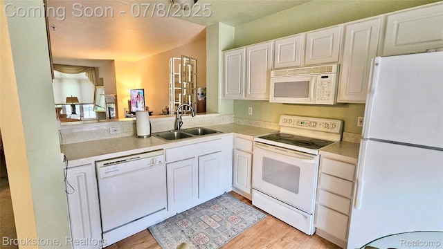 20059 Rodeo Ct, Southfield, MI 48075 - kitchen with white appliances, light wood finished floors, white cabinetry, and light countertops