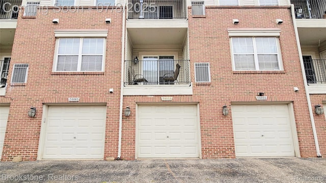 20059 Rodeo Ct, Southfield, MI 48075 - back of house with brick siding and driveway