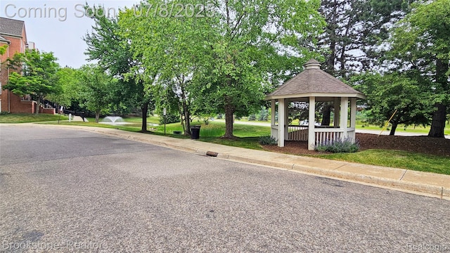20059 Rodeo Ct, Southfield, MI 48075 - view of asphalt road with sidewalks and curbs