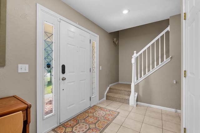 8181 Fawn Meadow Trl, Galesburg, MI 49053 - foyer featuring stairway, light tile patterned floors, and recessed lighting