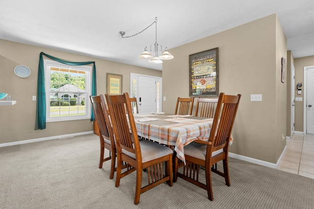 8181 Fawn Meadow Trl, Galesburg, MI 49053 - dining space featuring a chandelier and light carpet