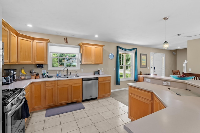 8181 Fawn Meadow Trl, Galesburg, MI 49053 - kitchen featuring appliances with stainless steel finishes, light countertops, pendant lighting, recessed lighting, and light tile patterned floors