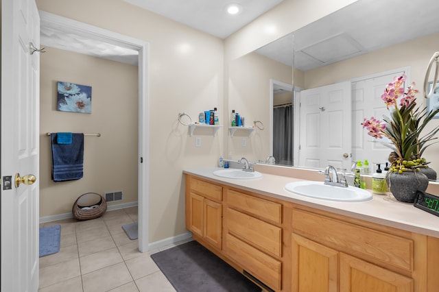 8181 Fawn Meadow Trl, Galesburg, MI 49053 - full bathroom featuring double vanity and tile patterned floors
