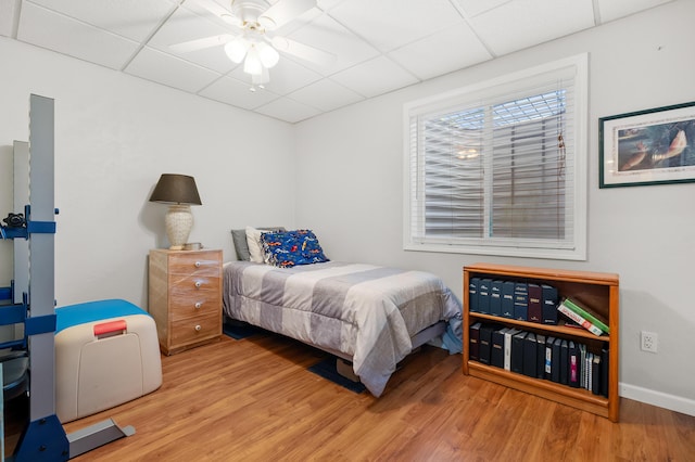 8181 Fawn Meadow Trl, Galesburg, MI 49053 - bedroom featuring a paneled ceiling, wood finished floors, and a ceiling fan