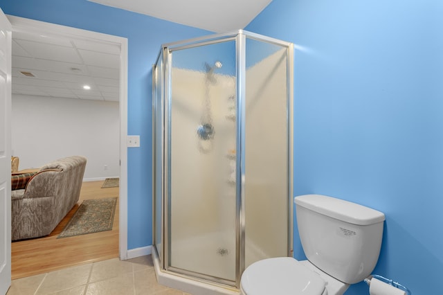 8181 Fawn Meadow Trl, Galesburg, MI 49053 - bathroom featuring a stall shower, tile patterned floors, a paneled ceiling, and recessed lighting