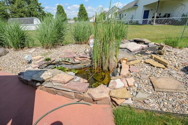 8181 Fawn Meadow Trl, Galesburg, MI 49053 - view of yard with a garden pond