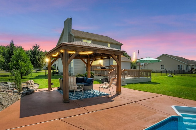 8181 Fawn Meadow Trl, Galesburg, MI 49053 - patio terrace at dusk featuring a gazebo, a patio area, an outdoor hangout area, and a deck