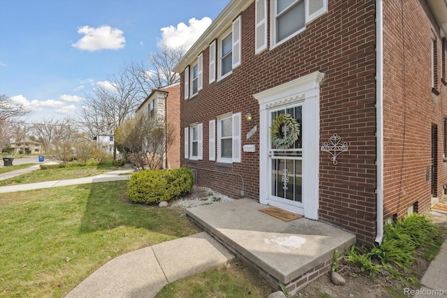 19340 Appoline St, Detroit, MI 48235 - view of property exterior featuring brick siding and a yard