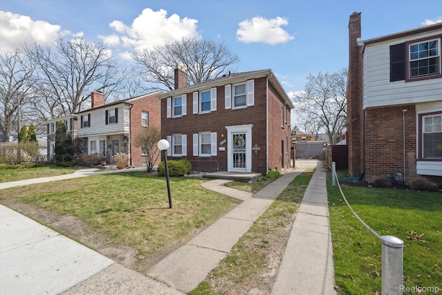 19340 Appoline St, Detroit, MI 48235 - townhome / multi-family property with a front yard and brick siding