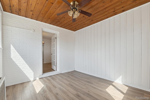 19340 Appoline St, Detroit, MI 48235 - empty room featuring brick wall, wood ceiling, ceiling fan, and light wood-style flooring