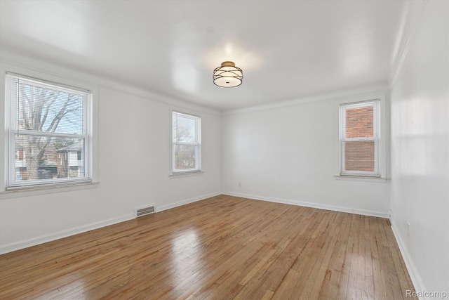 19340 Appoline St, Detroit, MI 48235 - empty room featuring light wood-type flooring, plenty of natural light, and crown molding