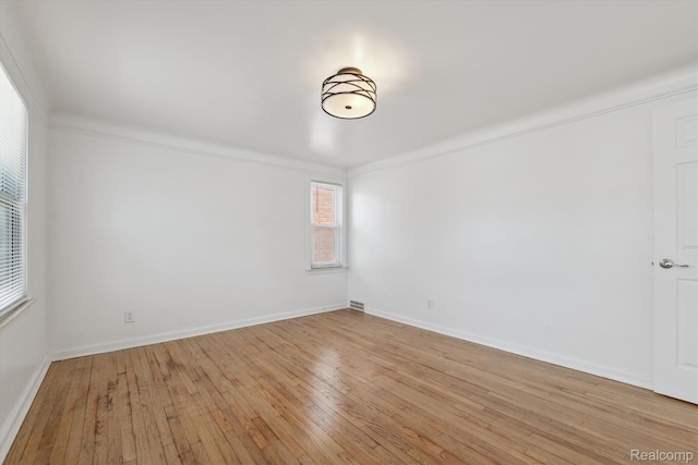 19340 Appoline St, Detroit, MI 48235 - unfurnished room with light wood finished floors and ornamental molding