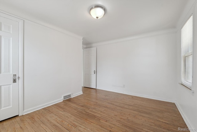 19340 Appoline St, Detroit, MI 48235 - empty room featuring light wood-style floors and ornamental molding