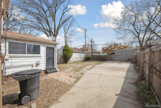 19340 Appoline St, Detroit, MI 48235 - fenced backyard with a patio and concrete driveway