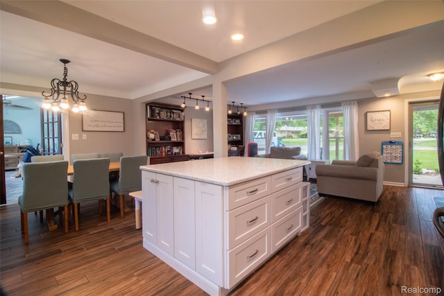 21102 Knudsen Dr, Grosse Ile, MI 48138 - kitchen with open floor plan, white cabinetry, dark wood-style floors, a chandelier, and recessed lighting