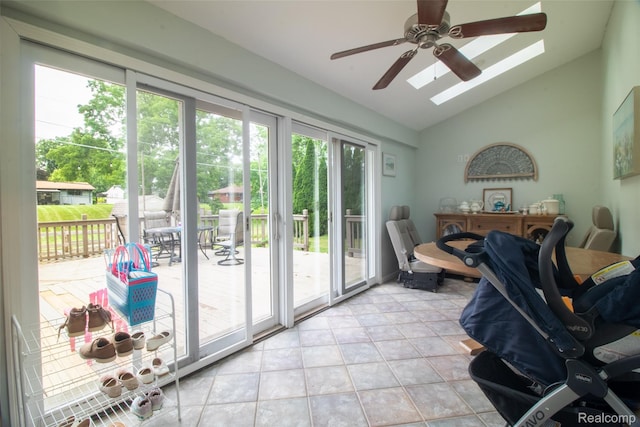 21102 Knudsen Dr, Grosse Ile, MI 48138 - doorway to outside featuring vaulted ceiling, healthy amount of natural light, a ceiling fan, and a skylight
