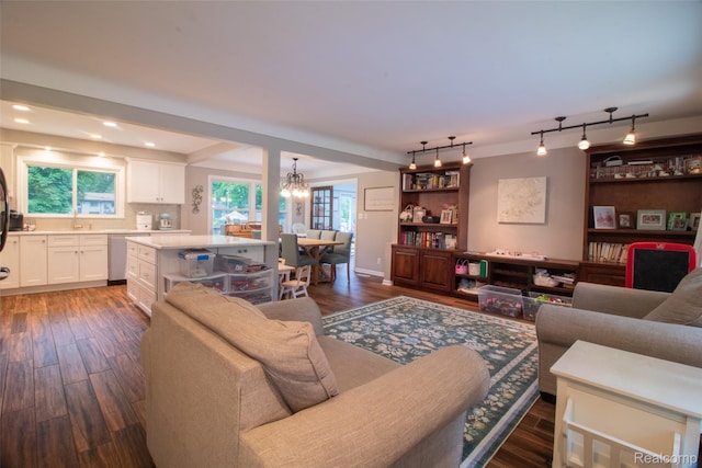 21102 Knudsen Dr, Grosse Ile, MI 48138 - living room with dark wood-type flooring, a chandelier, recessed lighting, and healthy amount of natural light