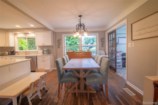 21102 Knudsen Dr, Grosse Ile, MI 48138 - dining area with dark wood finished floors, recessed lighting, and a chandelier