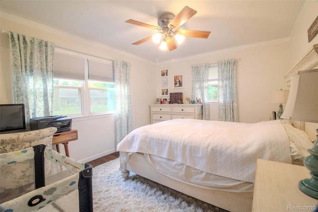 21102 Knudsen Dr, Grosse Ile, MI 48138 - bedroom featuring wood finished floors, ceiling fan, and ornamental molding