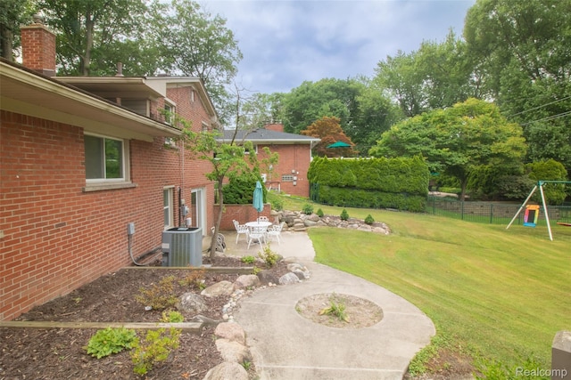 21102 Knudsen Dr, Grosse Ile, MI 48138 - view of yard featuring a patio area and a playground