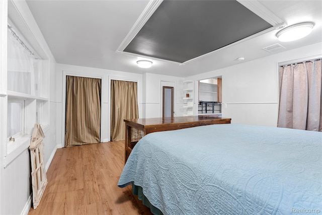 6917 Belton St, Garden City, MI 48135 - bedroom featuring light wood-style flooring and two closets